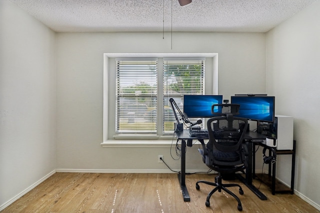 office space featuring hardwood / wood-style floors and a textured ceiling