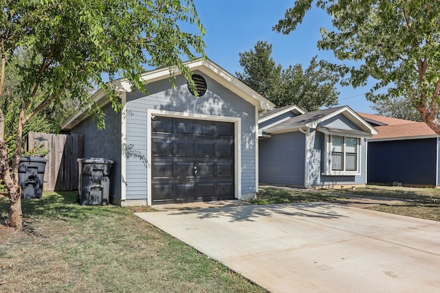 single story home with a front lawn and a garage