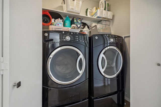 washroom featuring washing machine and dryer