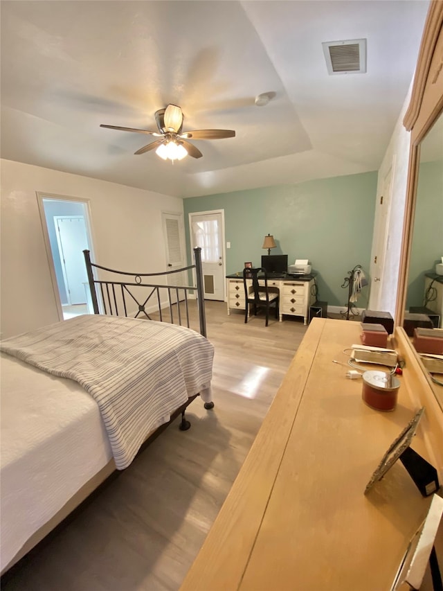 bedroom featuring light wood-type flooring and ceiling fan