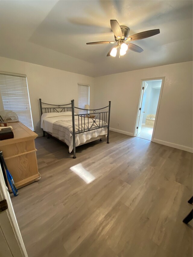 bedroom featuring hardwood / wood-style floors and ceiling fan