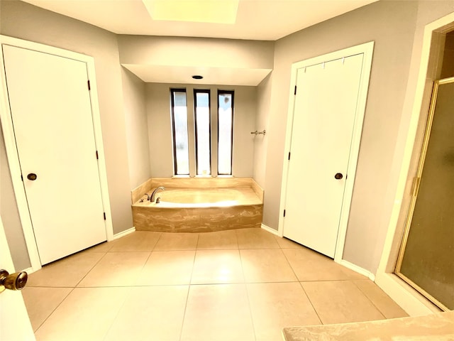 bathroom with plus walk in shower and tile patterned flooring