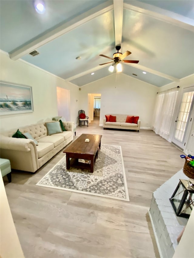 living room with hardwood / wood-style flooring, lofted ceiling with beams, and ceiling fan