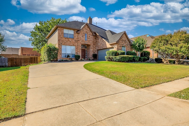 view of front facade with a front lawn and a garage