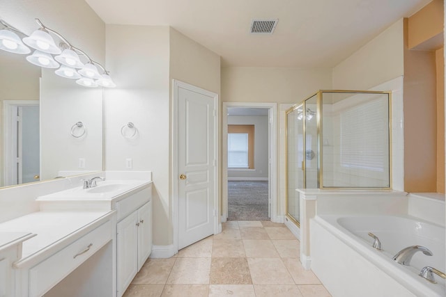 bathroom with vanity, tile patterned floors, and independent shower and bath