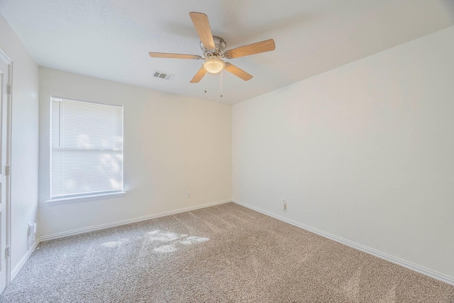 carpeted empty room with ceiling fan