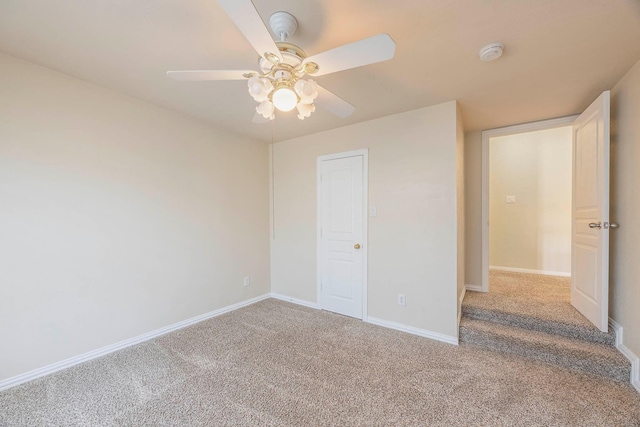 carpeted empty room with ceiling fan