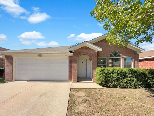 single story home with a garage