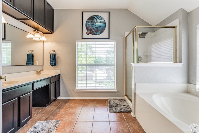 bathroom featuring vanity, shower with separate bathtub, a healthy amount of sunlight, and vaulted ceiling