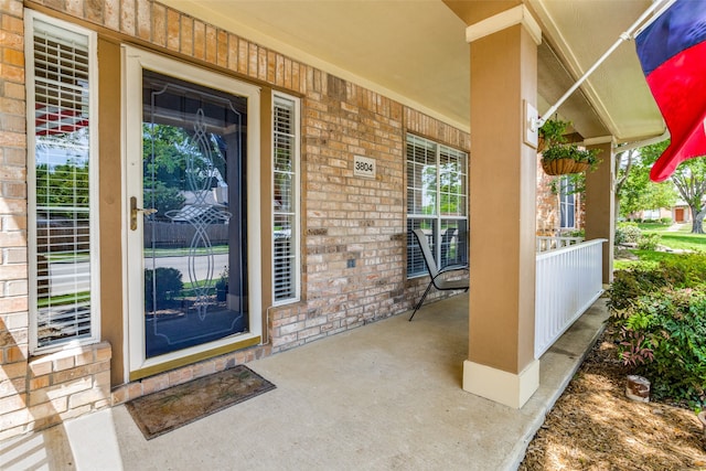 doorway to property featuring a porch