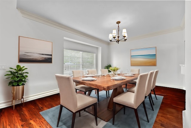 dining space featuring an inviting chandelier, ornamental molding, and dark hardwood / wood-style flooring