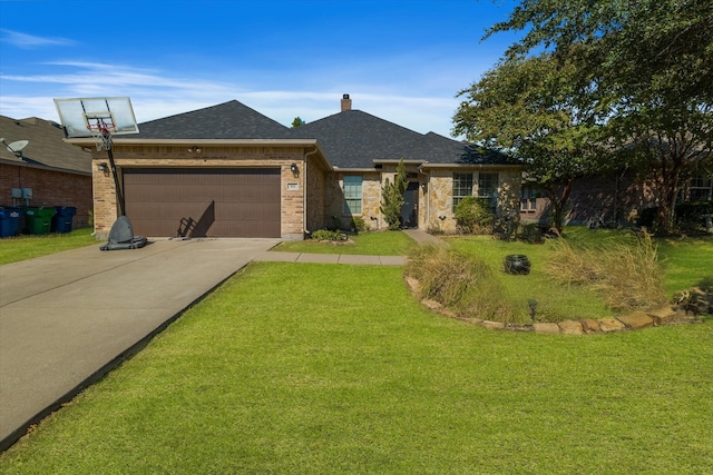 ranch-style house featuring a front yard and a garage