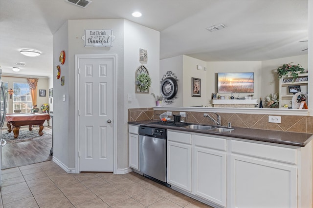 kitchen featuring sink, pool table, white cabinetry, stainless steel dishwasher, and light tile patterned floors