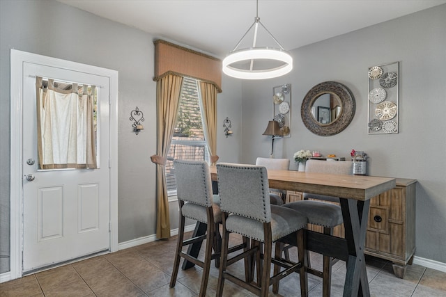 dining space with tile patterned floors