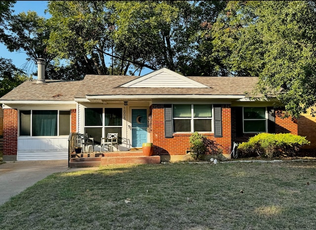 view of front of property with a front yard and a porch