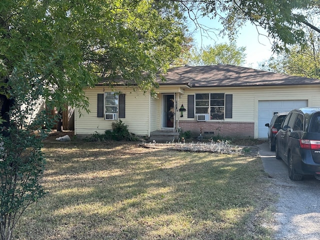 ranch-style home with a garage and a front lawn