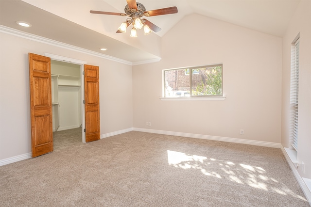 unfurnished bedroom with a closet, ceiling fan, carpet flooring, and lofted ceiling