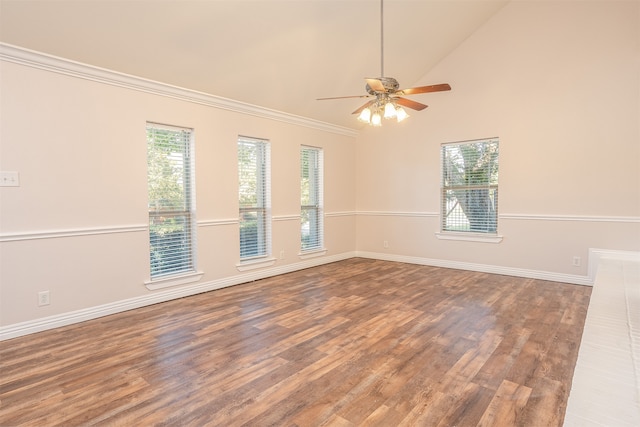 unfurnished room featuring dark wood-type flooring, crown molding, high vaulted ceiling, and ceiling fan