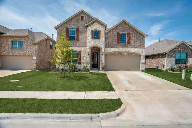 view of front of property featuring a garage and a front lawn