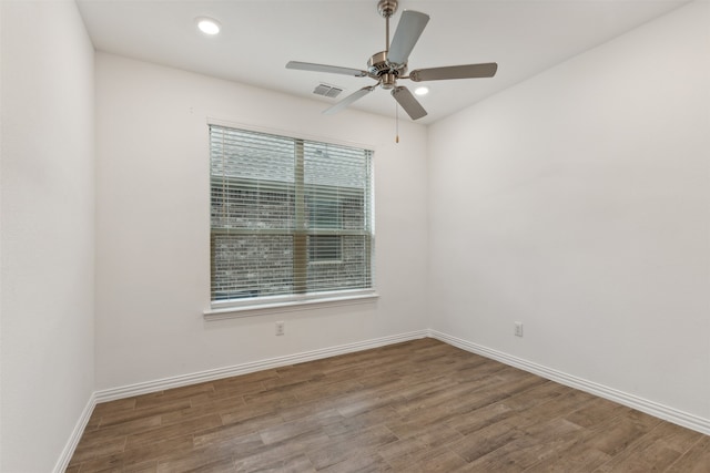 unfurnished room with hardwood / wood-style flooring and ceiling fan