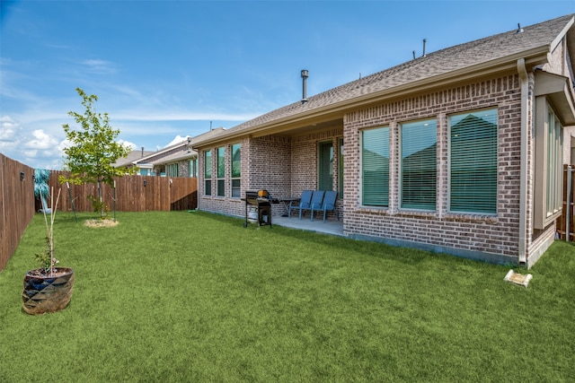 back of property featuring a patio area and a lawn