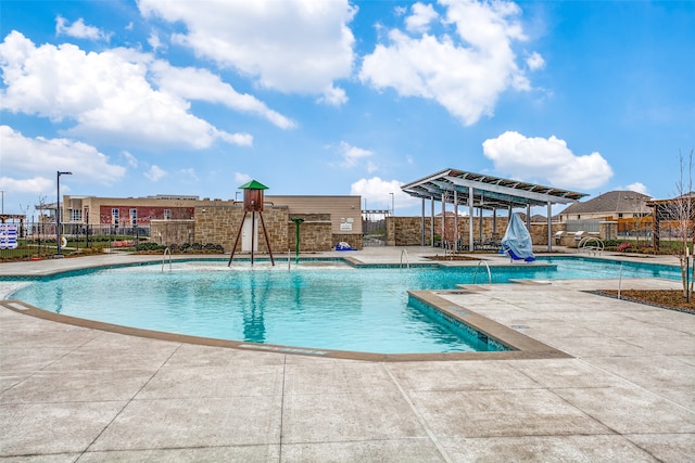 view of swimming pool featuring a patio area