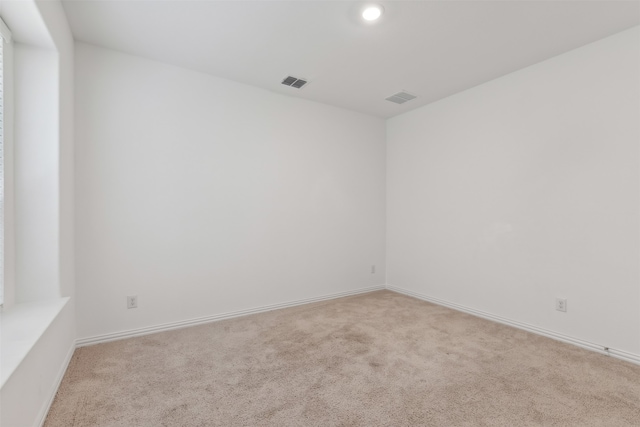 empty room with light colored carpet