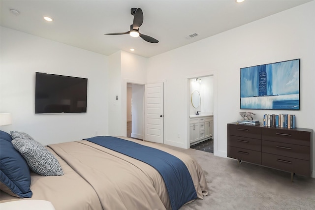 bedroom featuring visible vents, dark carpet, connected bathroom, and recessed lighting