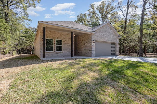 view of front facade with a front lawn and a garage