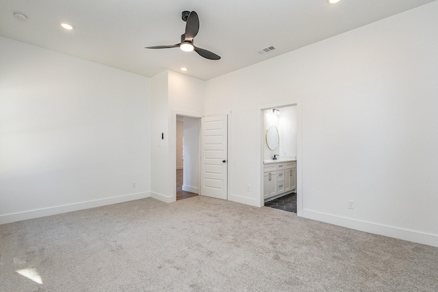 unfurnished bedroom with baseboards, visible vents, dark carpet, and recessed lighting