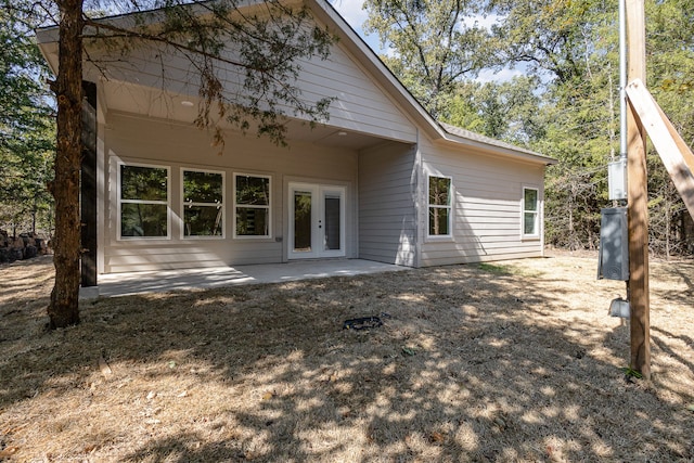 back of property with french doors and a patio