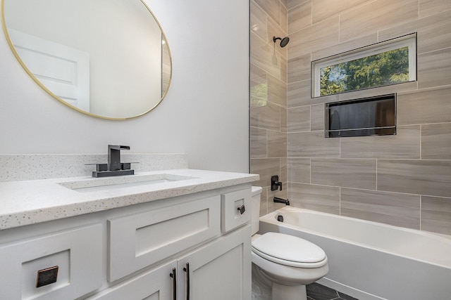 bathroom featuring toilet, tub / shower combination, and vanity