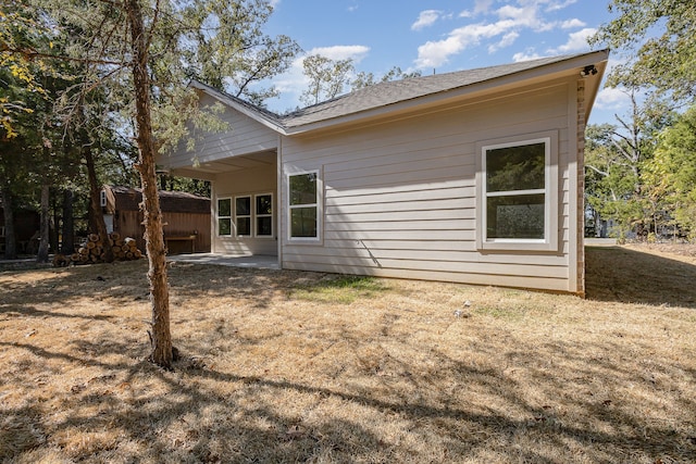 rear view of house featuring a patio