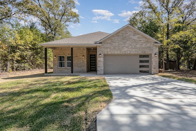 view of front facade with brick siding, a shingled roof, an attached garage, a front yard, and driveway