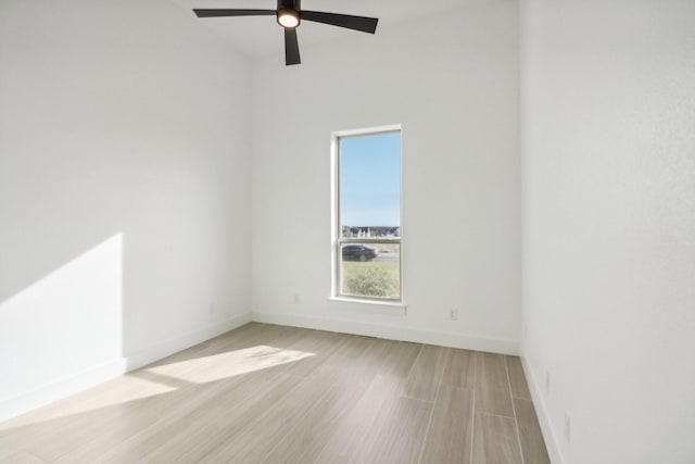 empty room featuring ceiling fan and light hardwood / wood-style floors