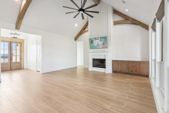 unfurnished living room featuring beamed ceiling, light hardwood / wood-style floors, ceiling fan with notable chandelier, and high vaulted ceiling