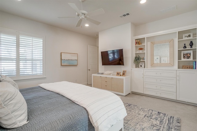 bedroom with ceiling fan and light colored carpet