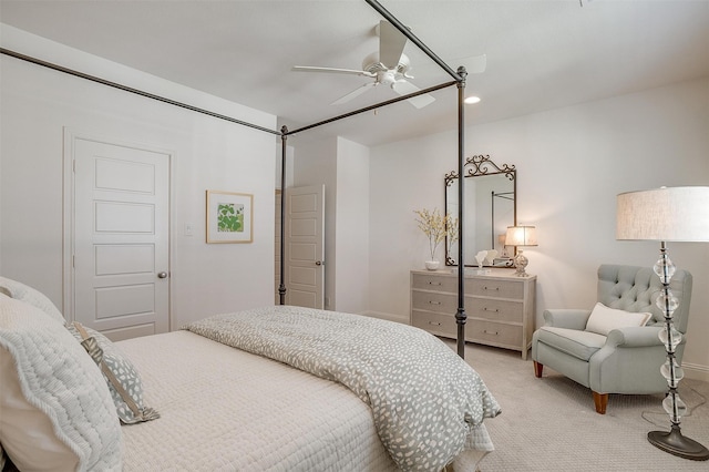 bedroom with light colored carpet and ceiling fan