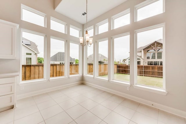 unfurnished sunroom with a notable chandelier