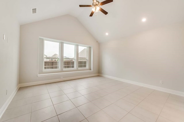 tiled spare room featuring lofted ceiling and ceiling fan