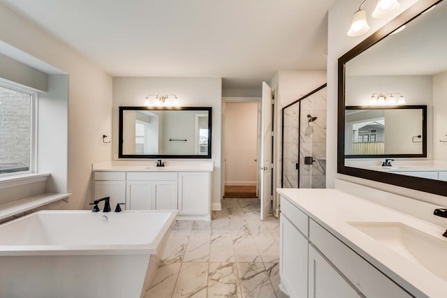 bathroom featuring vanity and separate shower and tub