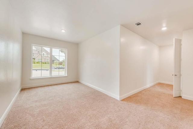 2802 Chandler Ct, Mansfield, TX 76063 - spare room with light colored carpet, baseboards, visible vents, and recessed lighting