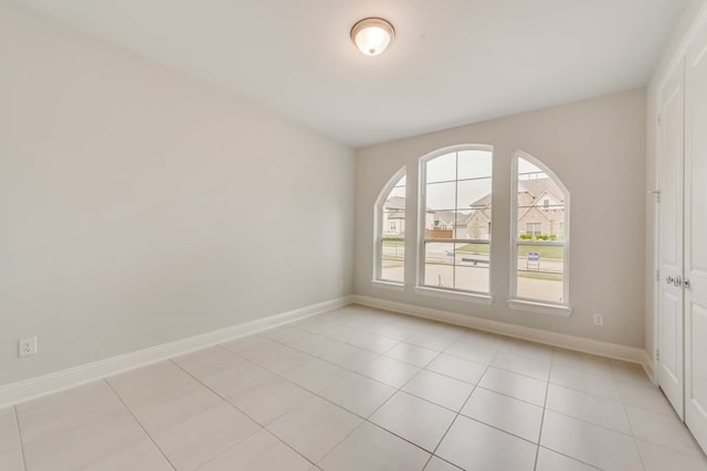 spare room featuring light tile patterned floors