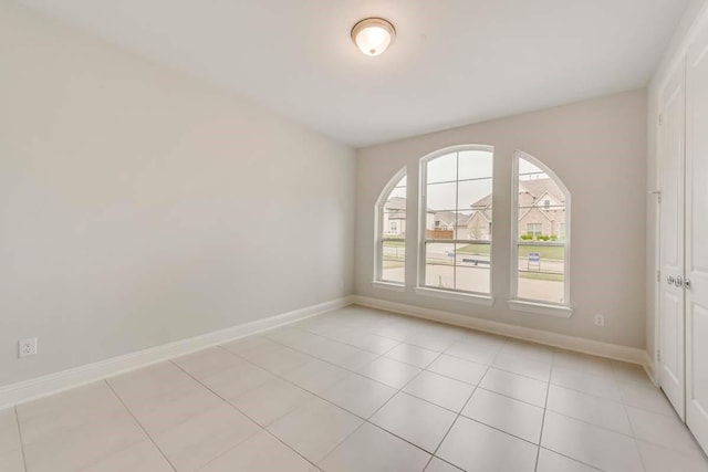 2802 Chandler Ct, Mansfield, TX 76063 - spare room featuring baseboards and light tile patterned floors