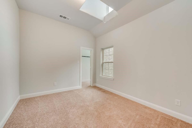 2802 Chandler Ct, Mansfield, TX 76063 - carpeted spare room featuring baseboards, lofted ceiling with skylight, and visible vents