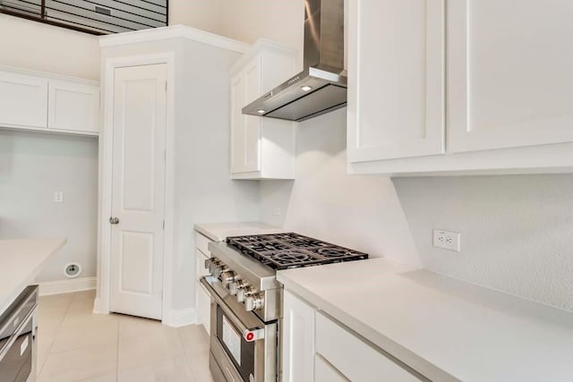 2802 Chandler Ct, Mansfield, TX 76063 - kitchen with white cabinets, light countertops, high end stove, wall chimney range hood, and light tile patterned floors