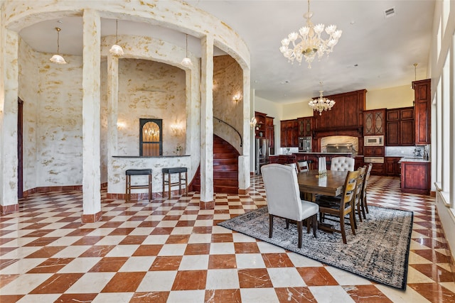 dining space featuring an inviting chandelier