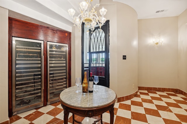 interior space with an inviting chandelier and beverage cooler