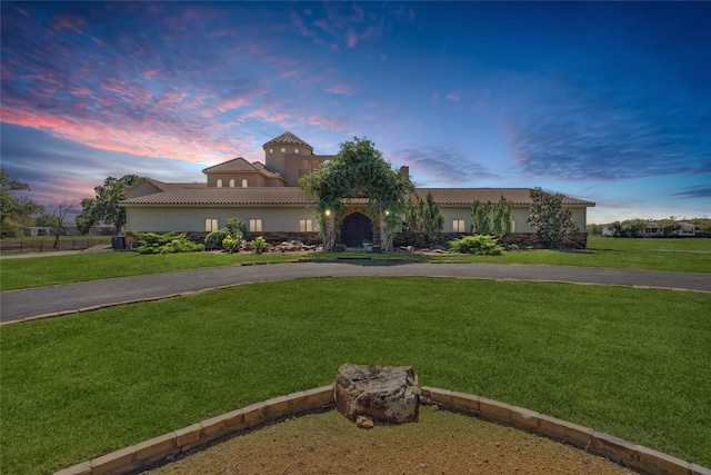 mediterranean / spanish-style house featuring a yard