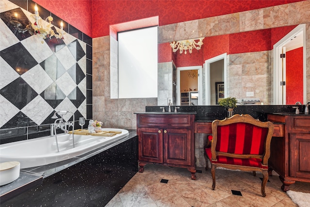 bathroom featuring vanity, tiled bath, and tile walls